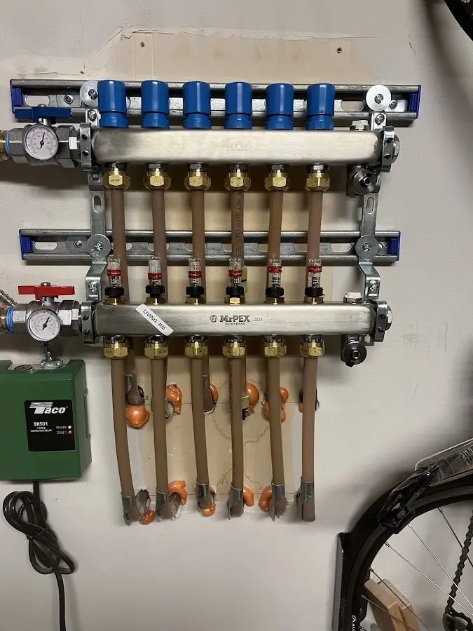 Plumber performing Water Heater Repair at a residential property in Hinesburg